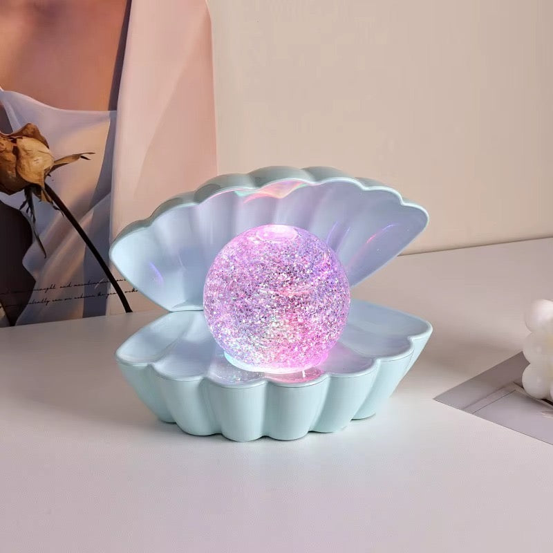 A beautiful shell pearl night lamp that adds soft light and luxury vibes to your room.