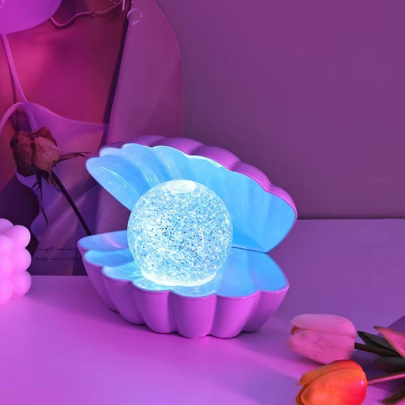 A beautiful shell pearl night lamp that adds soft light and luxury vibes to your room.